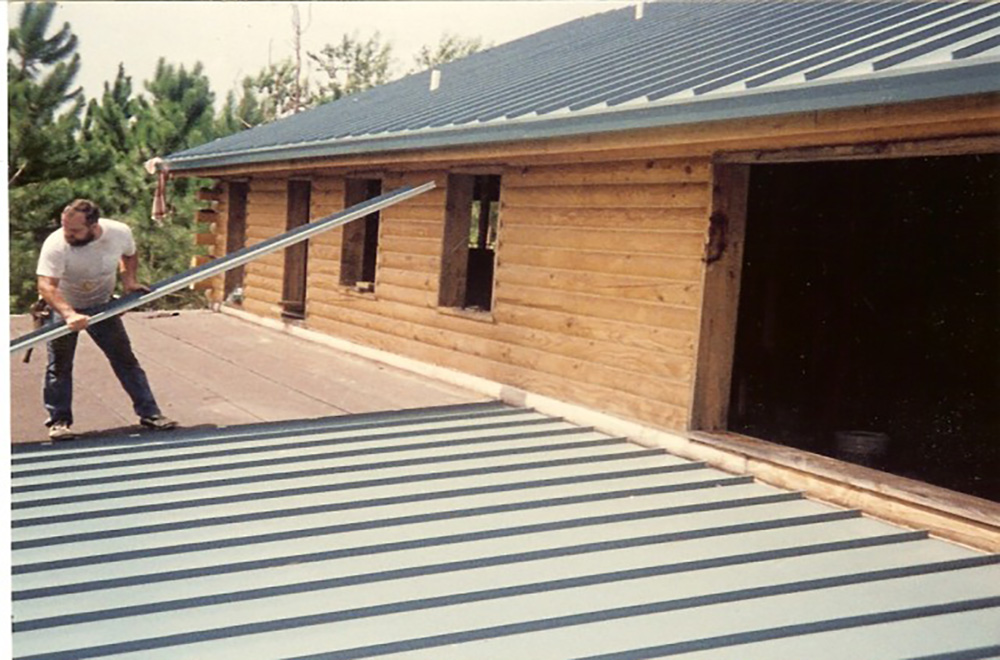 Installing A Standing Seam Metal Roof On Log Home In Dade City