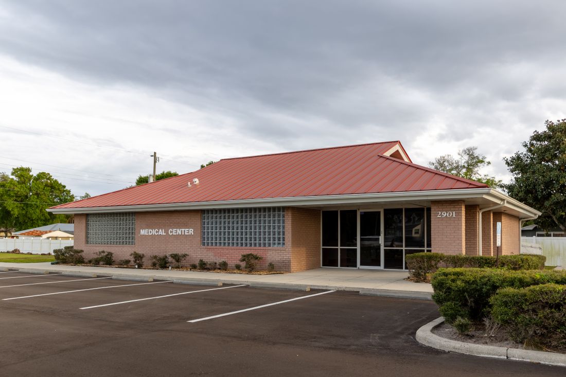Metal roof on a business the roof color is red.