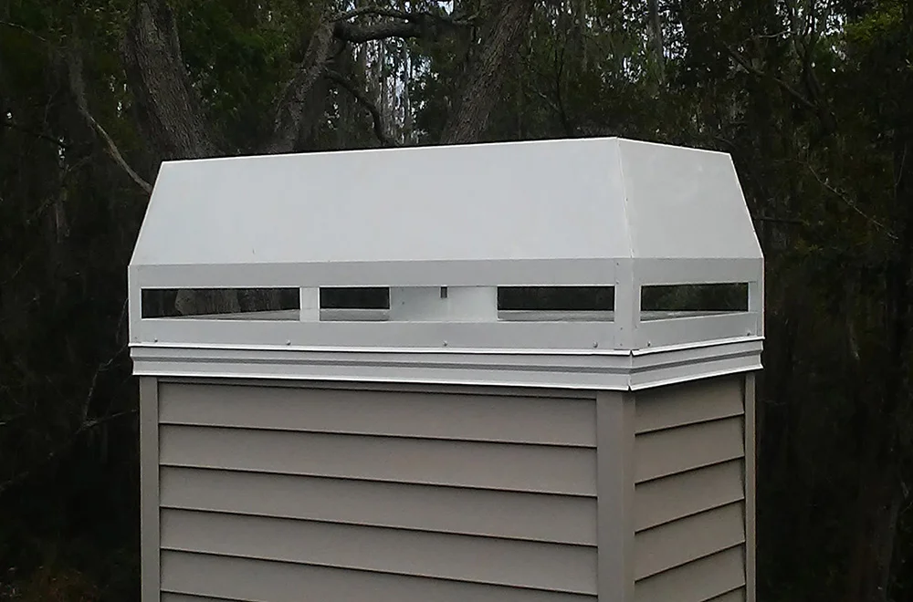 Custom Chimney Cap we fabricated in our shop then installed it site